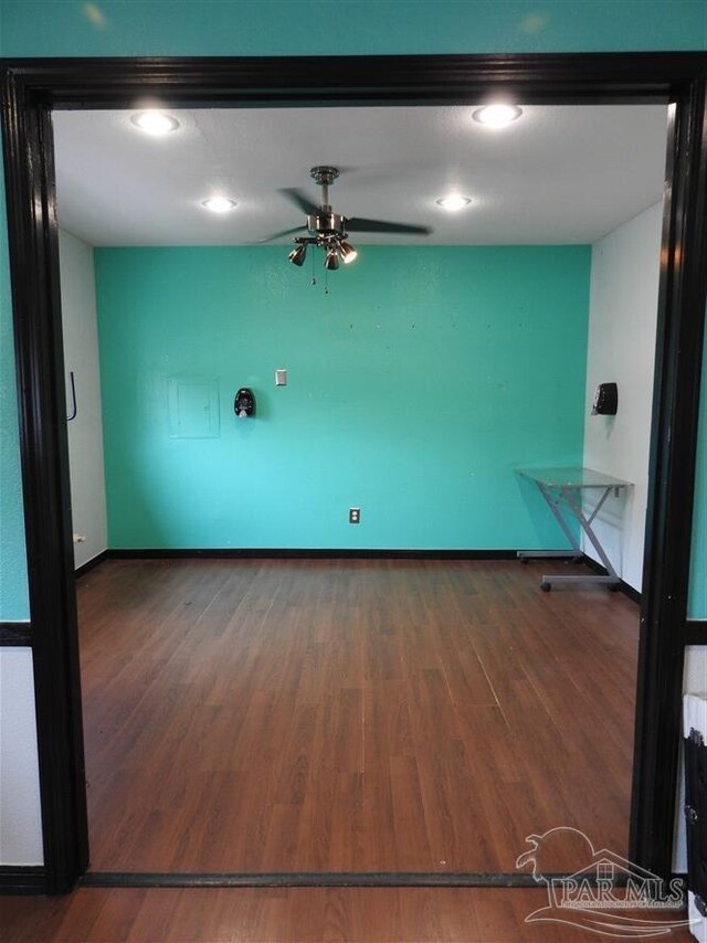 empty room featuring ceiling fan and wood-type flooring