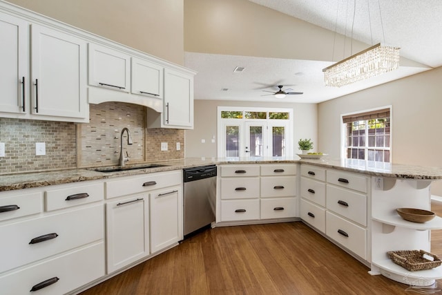 kitchen with wood finished floors, a sink, white cabinets, stainless steel dishwasher, and open shelves