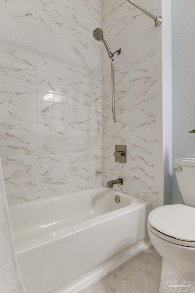 bathroom with toilet and shower / bath combo with shower curtain