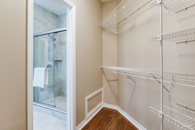 spacious closet with wood finished floors