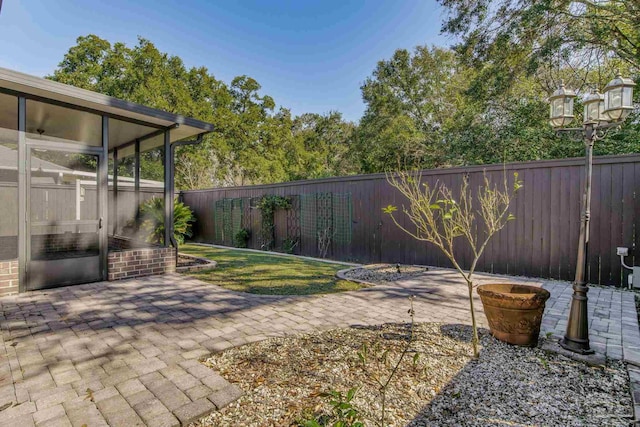 view of yard featuring a fenced backyard and a patio