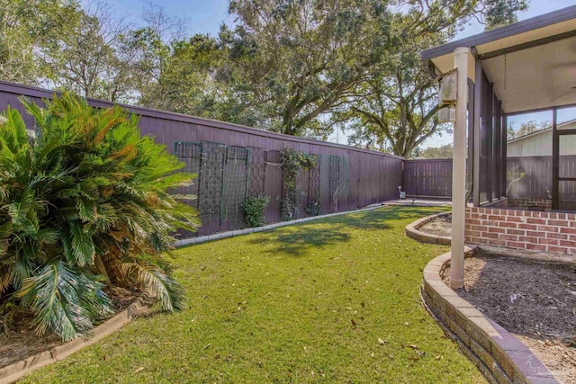 view of yard with a fenced backyard