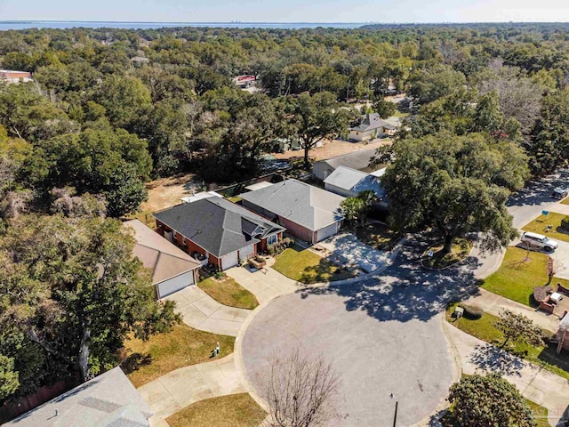 birds eye view of property featuring a residential view and a forest view