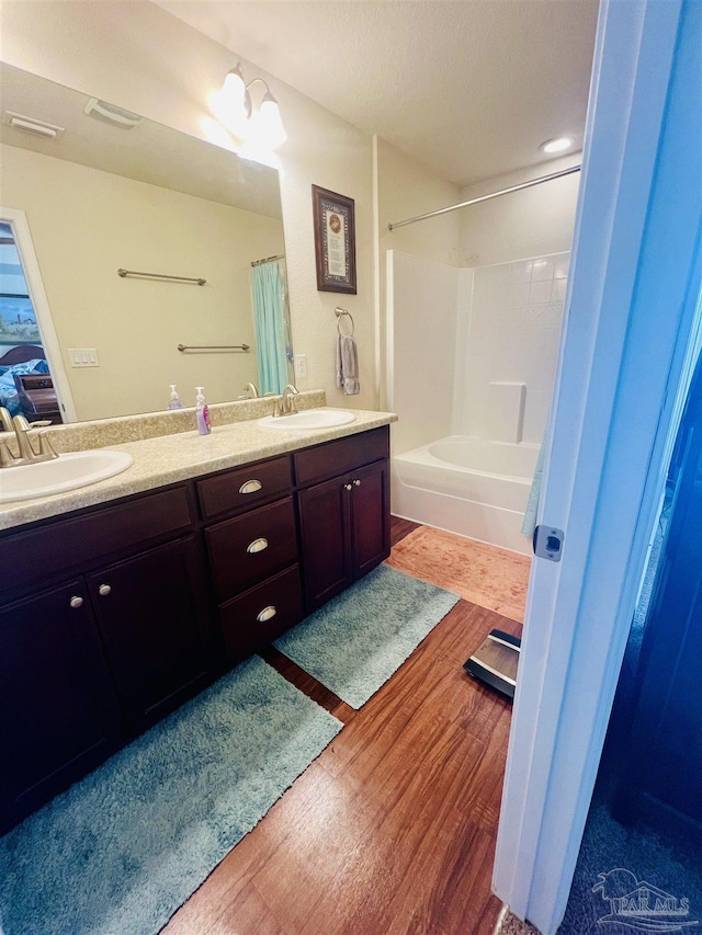 bathroom featuring a chandelier, hardwood / wood-style floors, and vanity