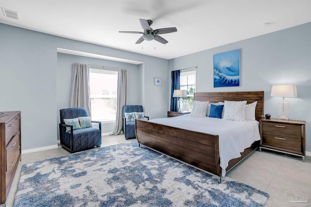6526 Carlinga Dr, Pensacola, FL 32507 - bedroom with light tile patterned flooring, ceiling fan, and baseboards