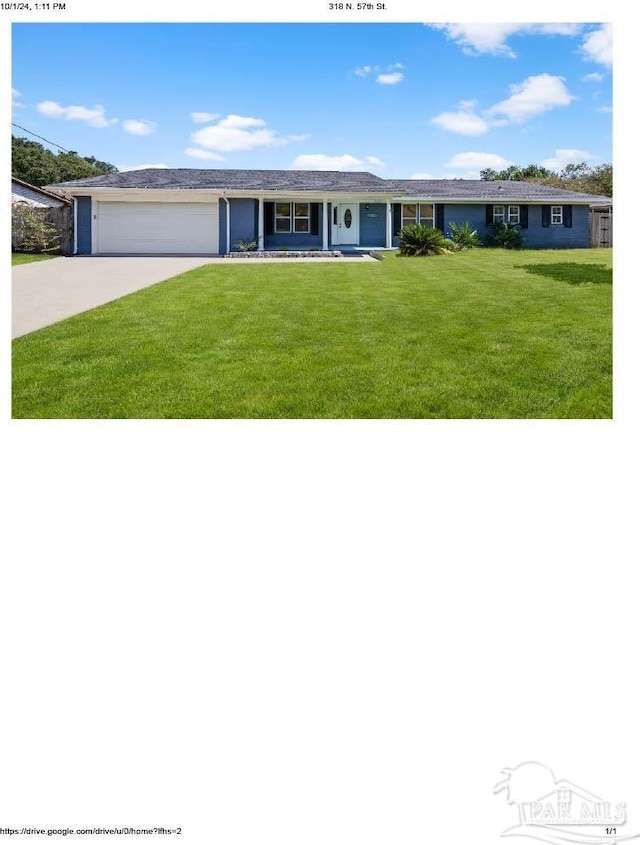 single story home with a front yard and a garage