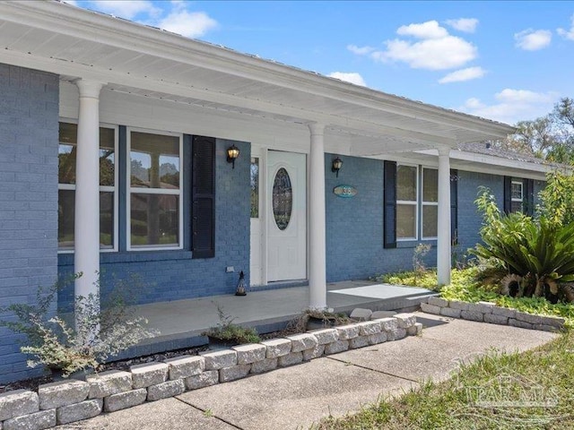 property entrance with covered porch