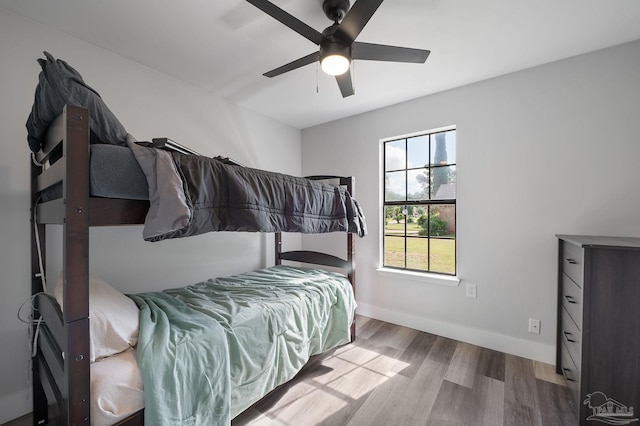 bedroom featuring ceiling fan and wood-type flooring