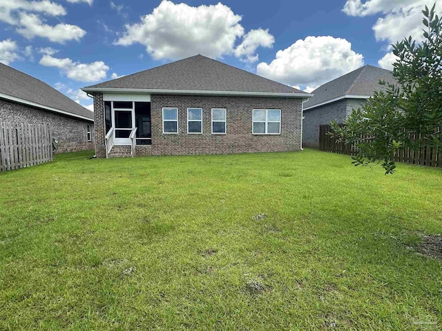 7581 Burnside Loop, Pensacola, FL 32526 - rear view of house featuring brick siding, entry steps, and a sunroom