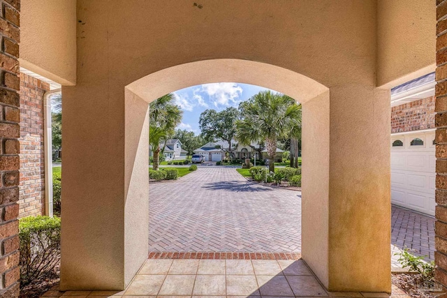 view of patio with a garage and a residential view