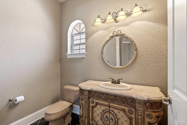 half bathroom featuring toilet and vanity