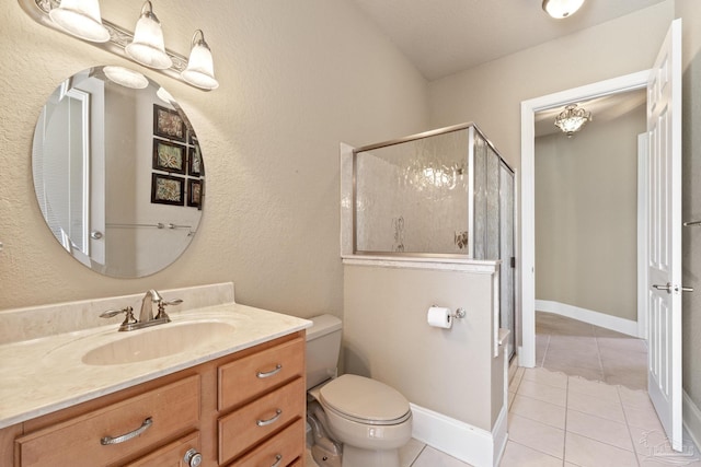 full bathroom featuring tile patterned floors, a stall shower, toilet, and vanity