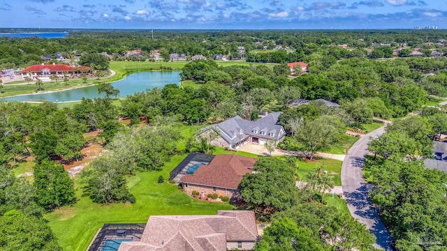 aerial view of residential area featuring a nearby body of water