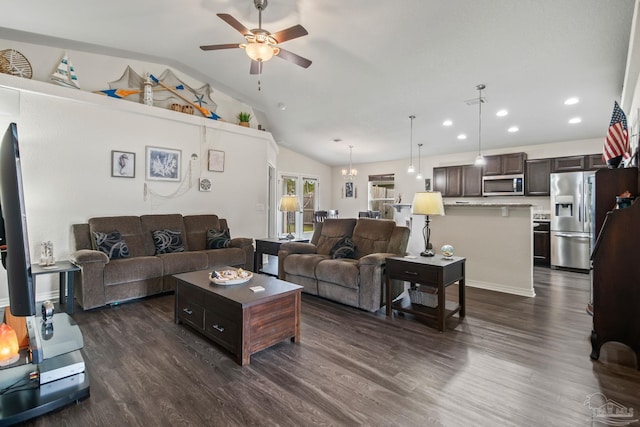 living room with dark hardwood / wood-style flooring, ceiling fan, and vaulted ceiling