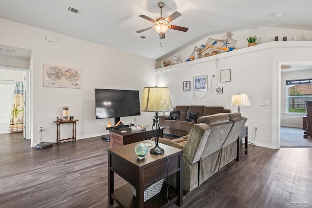 living room with lofted ceiling, ceiling fan, and dark wood-type flooring