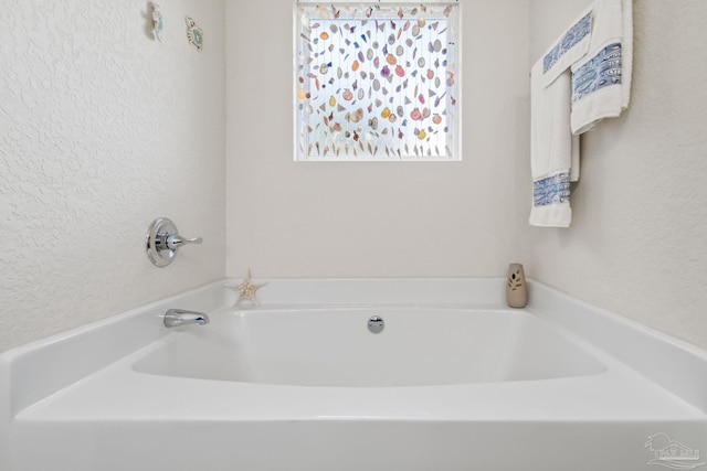 bathroom featuring a tub