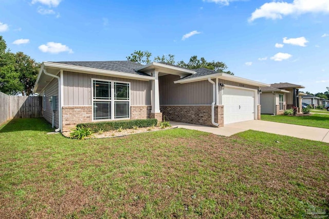 view of front of home with a garage and a front lawn