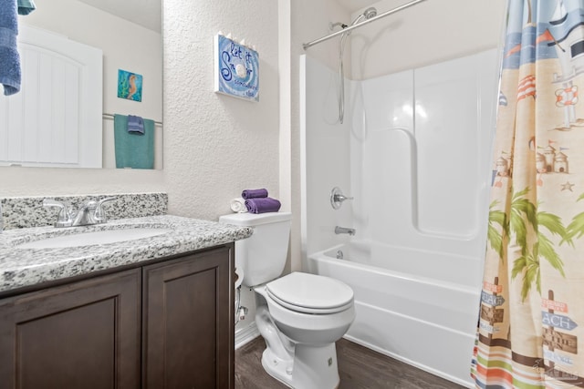 full bathroom featuring shower / bath combo, toilet, hardwood / wood-style flooring, and vanity