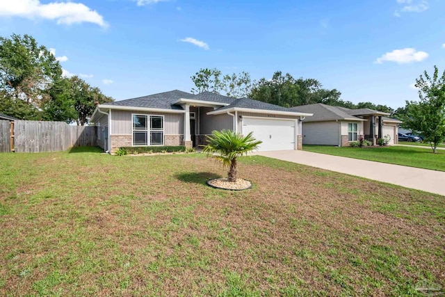 view of front of house with a garage and a front lawn