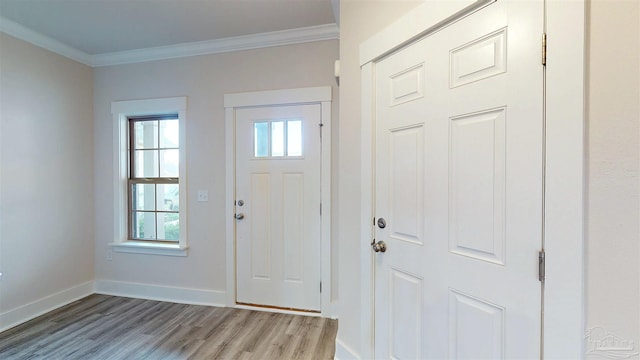 720 Brambling Ct, Cantonment, FL 32533 - entryway featuring wood finished floors, healthy amount of natural light, crown molding, and baseboards