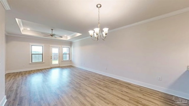 720 Brambling Ct, Cantonment, FL 32533 - spare room featuring ornamental molding, baseboards, a raised ceiling, and wood finished floors