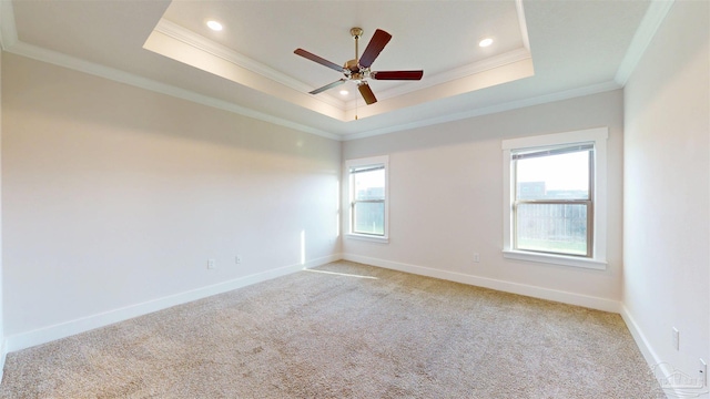 720 Brambling Ct, Cantonment, FL 32533 - unfurnished room featuring crown molding, a tray ceiling, light carpet, baseboards, and ceiling fan
