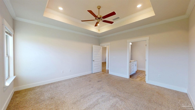 720 Brambling Ct, Cantonment, FL 32533 - unfurnished bedroom featuring light colored carpet, a raised ceiling, ornamental molding, baseboards, and ensuite bathroom