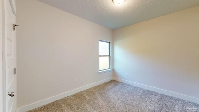 720 Brambling Ct, Cantonment, FL 32533 - carpeted spare room featuring baseboards and a textured ceiling