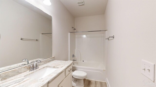 720 Brambling Ct, Cantonment, FL 32533 - full bath with vanity, toilet, shower / bath combination, and wood finished floors