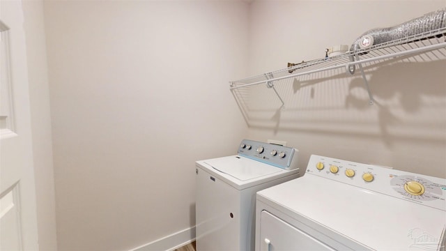 720 Brambling Ct, Cantonment, FL 32533 - washroom with washer and dryer and baseboards