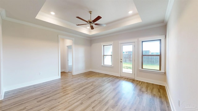 720 Brambling Ct, Cantonment, FL 32533 - spare room with ornamental molding, light wood-style flooring, a ceiling fan, baseboards, and a tray ceiling