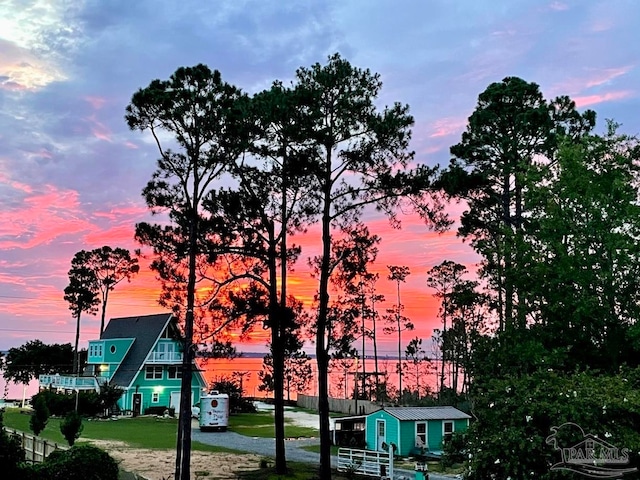 view of outdoor building at dusk