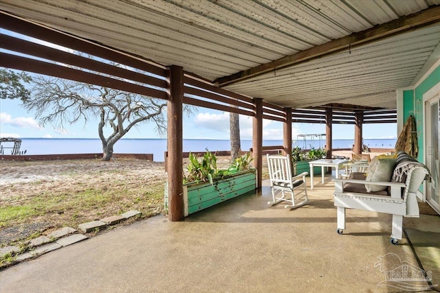 view of patio with a water view