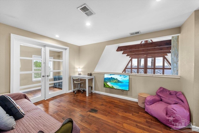 interior space with dark wood-type flooring, plenty of natural light, and french doors