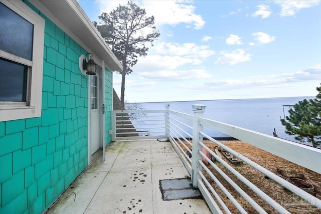 exterior space featuring a water view and a balcony