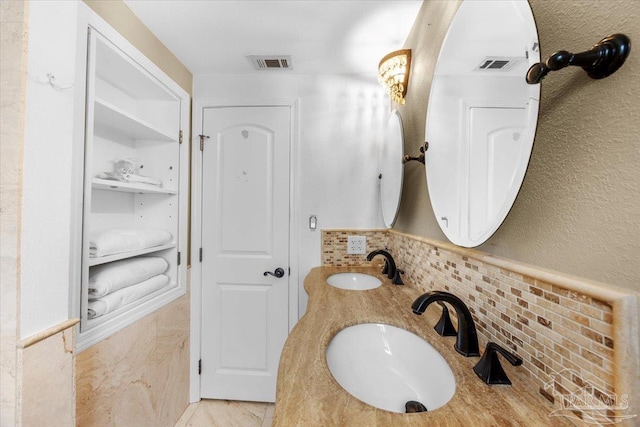 bathroom featuring tile walls and vanity