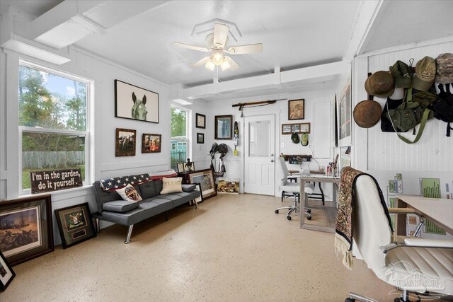 home office featuring a wealth of natural light and ceiling fan