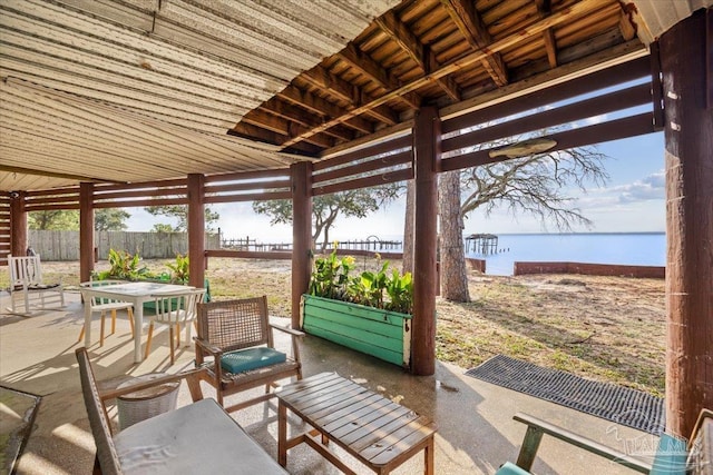 view of patio with a water view