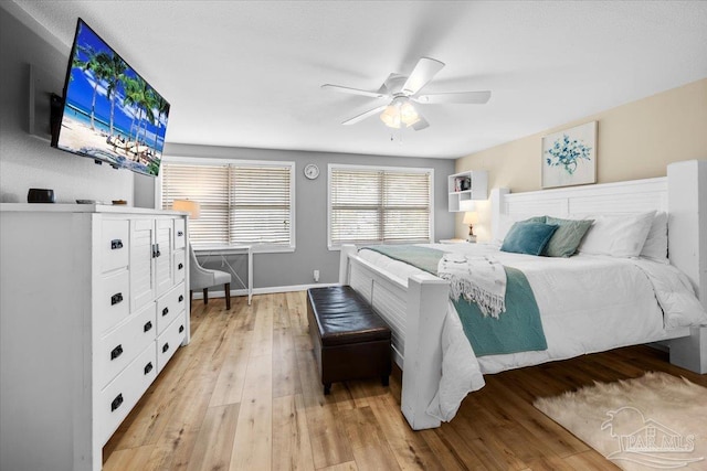 bedroom featuring light wood-type flooring and ceiling fan