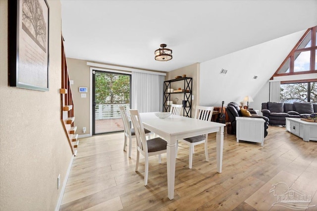 dining area with light hardwood / wood-style floors