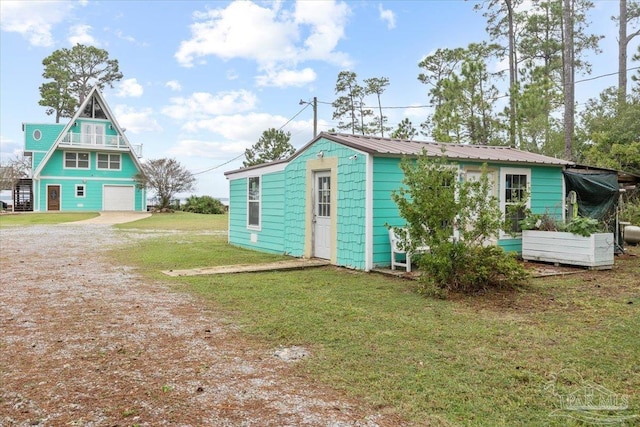 view of outbuilding with a yard