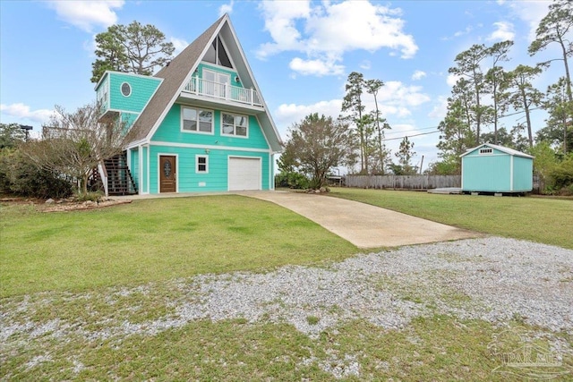 rear view of property with a garage and a yard