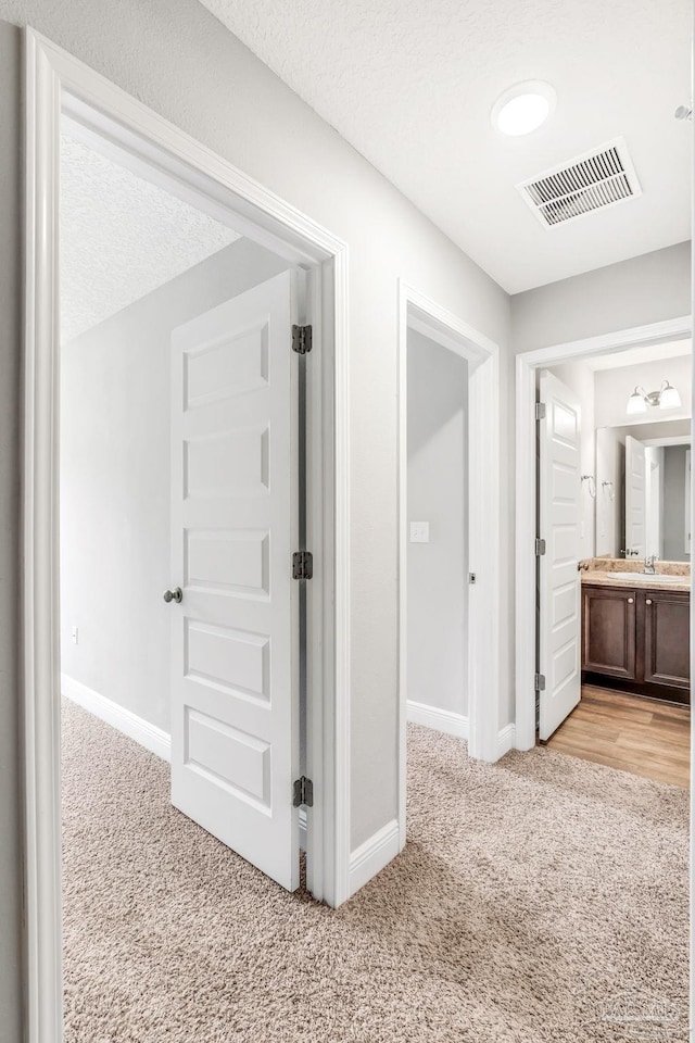 6004 Royal Port Ct, Pensacola, FL 32526 - corridor with light carpet and baseboards