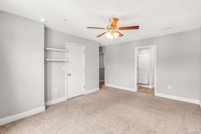 6004 Royal Port Ct, Pensacola, FL 32526 - unfurnished bedroom with carpet floors, a textured ceiling, ensuite bathroom, and a ceiling fan