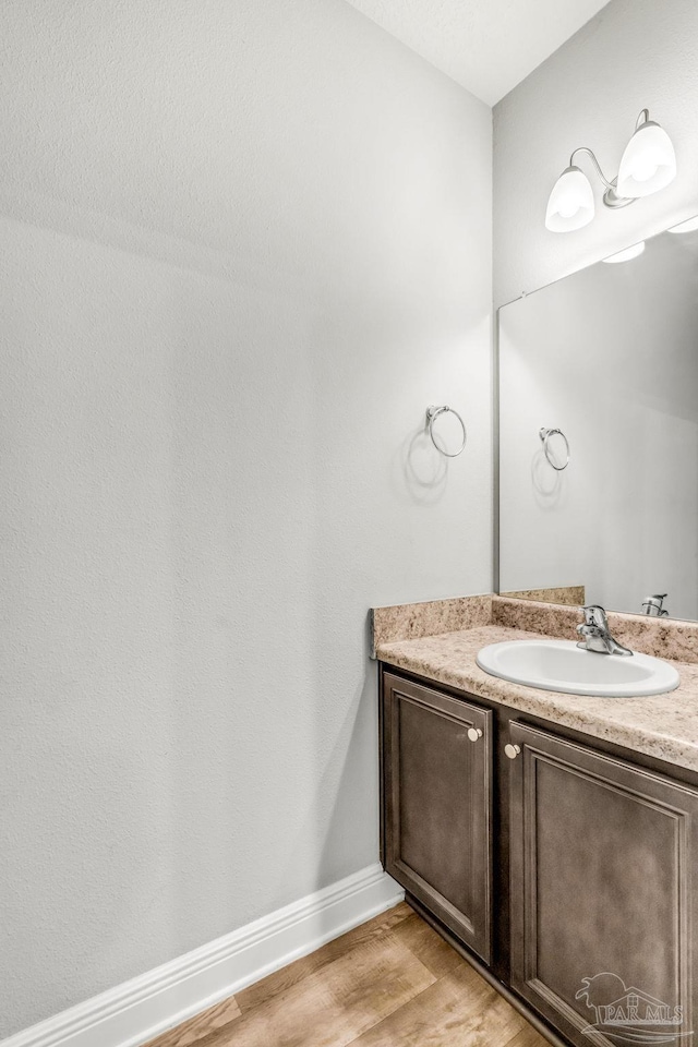 6004 Royal Port Ct, Pensacola, FL 32526 - bathroom featuring wood finished floors and vanity