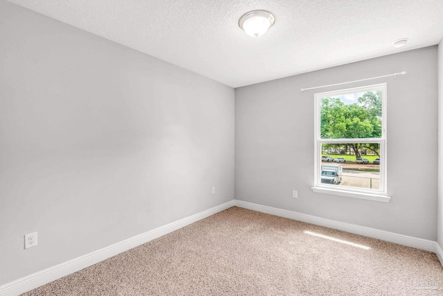 6004 Royal Port Ct, Pensacola, FL 32526 - carpeted spare room featuring a textured ceiling and a smoke detector