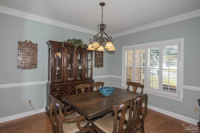 dining area featuring a chandelier, a textured ceiling, dark hardwood / wood-style flooring, and crown molding