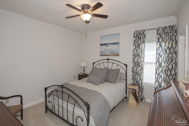 bedroom featuring a textured ceiling, ceiling fan, ornamental molding, and light carpet