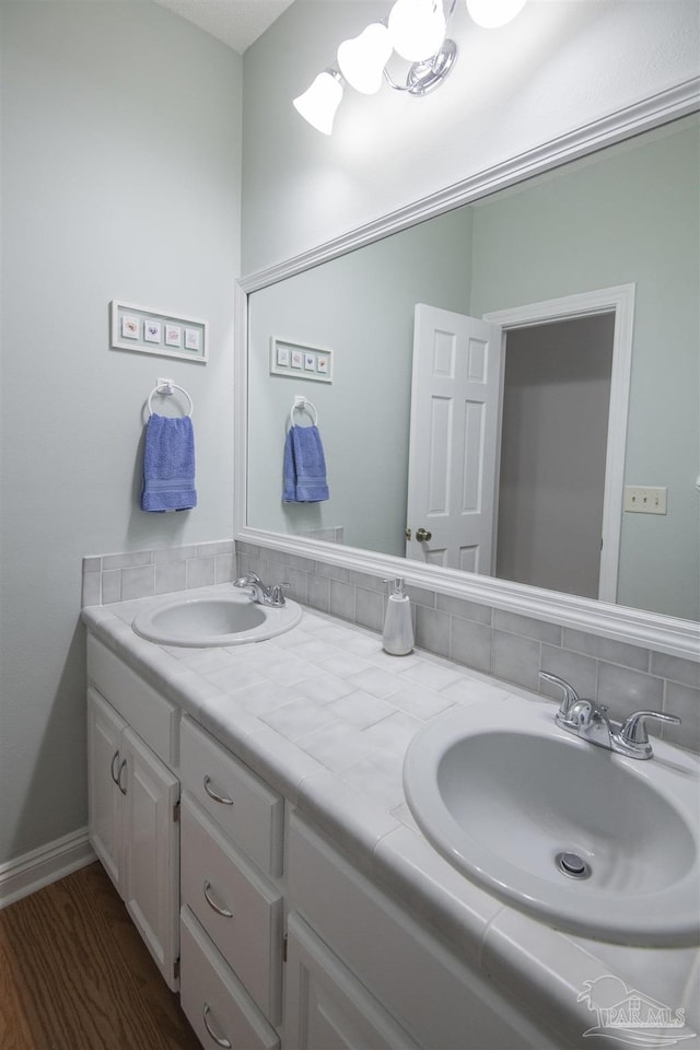 bathroom featuring hardwood / wood-style floors and vanity