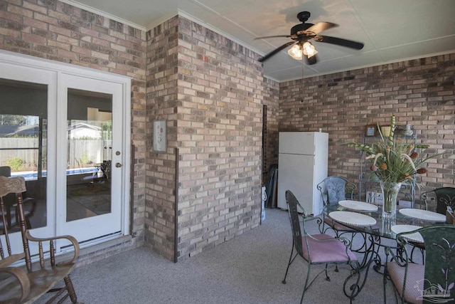 view of patio featuring french doors and ceiling fan